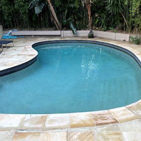 The same pool restored to clear blue water after green-pool recovery